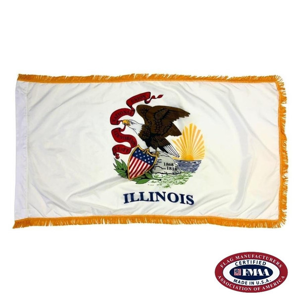 The indoor Illinois flag has gold fringe on 3 sides of the white field. In the center is a bald eagle on a rock with a banner in its beak. FMAA Certified Made in America seal.