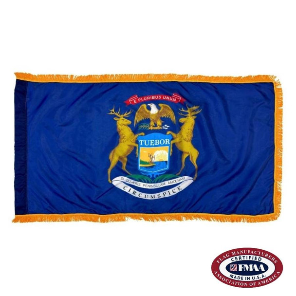 The indoor Michigan flag has 3 sides of gold fringe around the dark blue field. In the center is a seal depicting an elk, moose, & bald eagle. FMAA Certified Made in America seal.