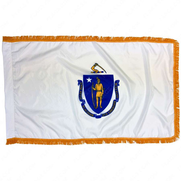 The indoor Massachusetts flag has 3 sides of gold fringe around the white field. In the center is a blue shield containing a yellow archer.