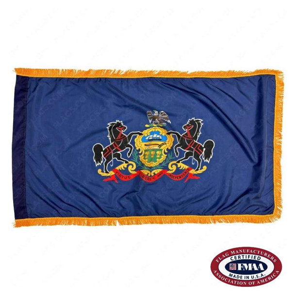 The indoor Pennsylvania flag has 3 sides of gold fringe around the dark blue field. In the center is the state seal flanked by 2 horses. FMAA Certified Made in America seal.
