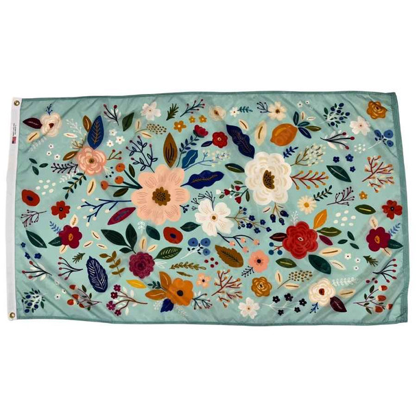 A light blue flag covered with drawings many different flowers.