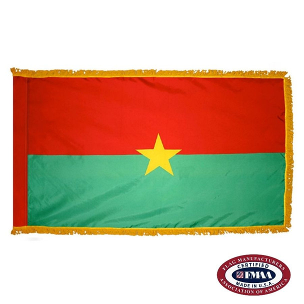 The indoor Burkina Faso flag has 3 sides of gold fringe around the two horizontal stripes of red and green. In the center is a yellow star. FMAA Certified Made in America seal.