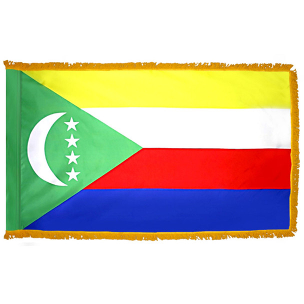 The indoor Comoros flag has 3 sides of gold fringe around 4 horizontal yellow, white, red & blue stripes. A green triangle is on the hoist side.