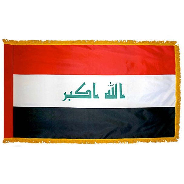 The indoor Iraq flag has 3 sides of gold fringe around a horizontal red, white, and black tricolor. The Takbir is written in green in the center.