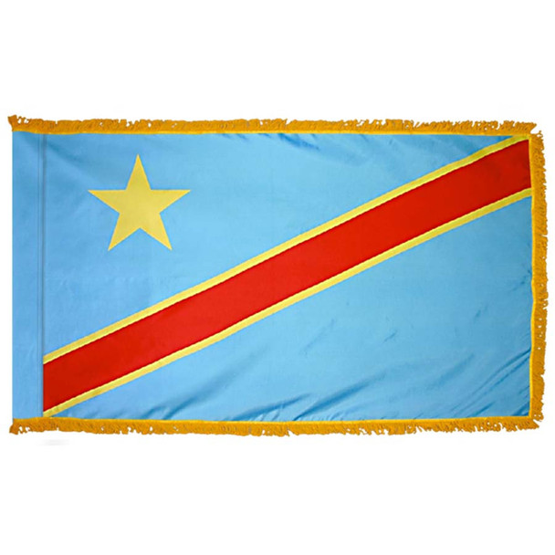 The indoor DRC flag has 3 sides of gold fringe around a light blue field with a diagonal red line and a gold star in the canton.