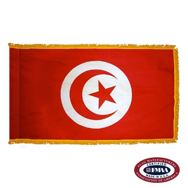 The indoor Tunisia flag has 3 sides of gold fringe around a red field with a white circle in the center with a red crescent and star. FMAA Certified Made in America seal.