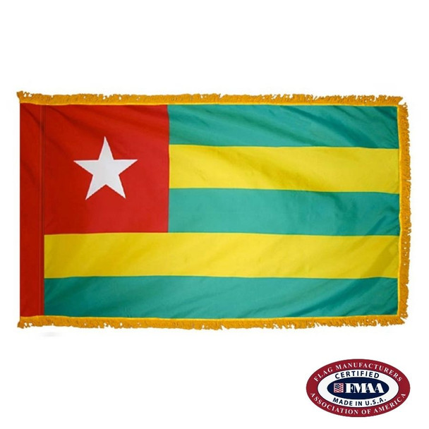 The indoor Togo flag has 3 sides of gold fringe around 5 horizontal green and yellow stripes. There is a white star in the red canton. FMAA Certified Made in America seal.
