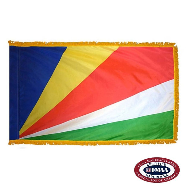 The indoor Seychelles flag has 3 sides of gold fringe around 5 blue, yellow, red, white, and green rays emanating from the bottom left. FMAA Certified Made in America seal.