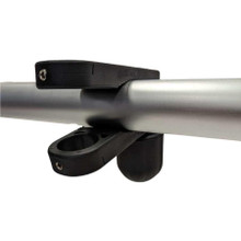 A black flagpole bracket clamped around a silver pole. At the ends of the clamp are wide holes for the insertion of a flagpole.