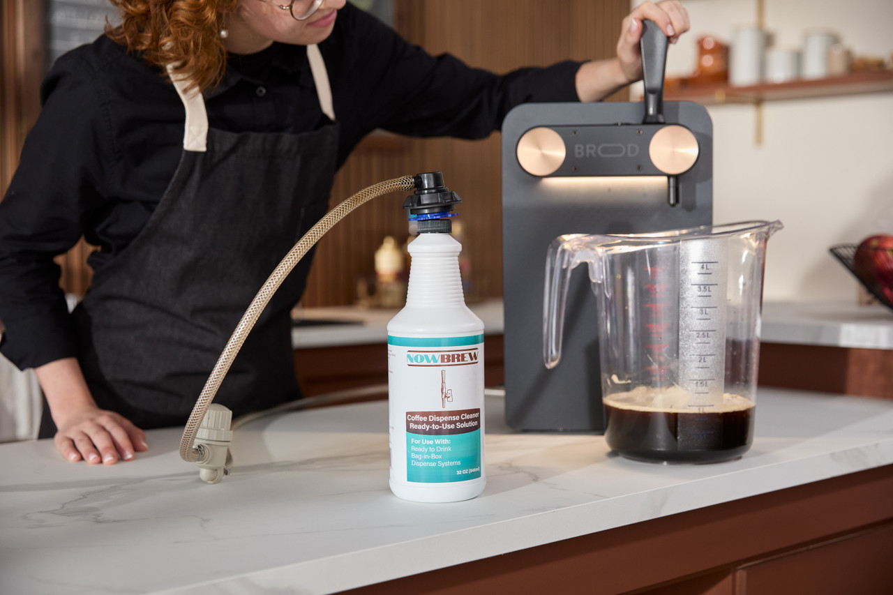 Coffee dispenser being cleaned with NowBrew Coffee Dispense Cleaner