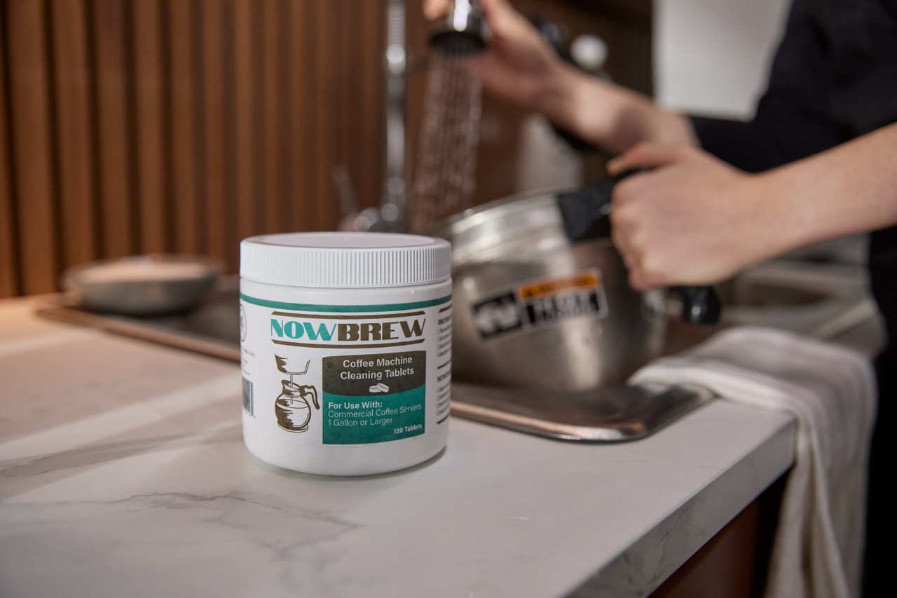 Coffee machine being cleaned with NowBrew Coffee Machine Cleaning Tablets