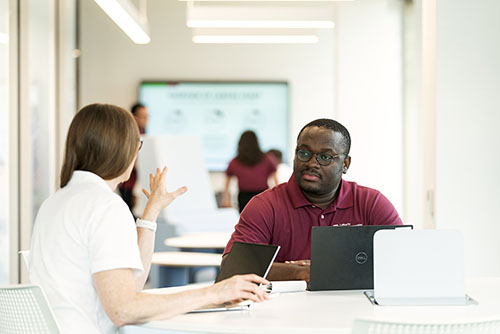 man and woman with laptop