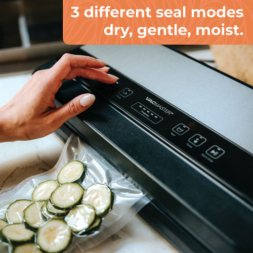 VacMaster Sidekick Compact Vacuum Sealer actively sealing a bag of fresh cucumbers, demonstrating its dry, gentle, and moist sealing modes. These multiple sealing options allow users to safely vacuum seal delicate foods, fresh produce, and moisture-rich items while maintaining optimal freshness. The compact vacuum sealing machine provides professional-grade food preservation for everyday use.
