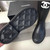 Black C Rain Boots on White