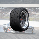 Close-up of asymmetric drift-optimized tread with rigid shoulder blocks and debris channels.