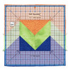 This is an image of a large Get Squared Ruler by June Tailor placed over a vibrant quilt block. The ruler, with its clear grid and blue markings, highlights a large triangle pattern composed of orange, green, and blue fabrics, demonstrating its use in precision cutting for quilting.