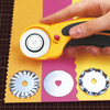 Image showing the OLFA Deluxe Ergonomic 45mm Rotary Cutter along side the difference blade types which also fit this model