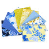 A fan of eight quilting fat quarters from the "Maison de Fleur Selection" by Kanvas Studios, featuring a lively mix of florals and geometric patterns in shades of blue and yellow, indicative of high-quality cotton textile designs.
