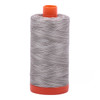 Large spool of Aurifil Silver Fox 50wt Egyptian cotton thread, variegated grey.