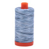 Large spool of Aurifil Stonewash Blues 50wt Egyptian cotton thread, blue variegated.