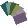 Six Jewelbox Spring fat quarters by Andover Fabrics, fanned out to display a variety of ditsy prints in fresh spring green and purple hues.
