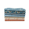 Blue Sunday Fat Quarter Bundle by Laundry Basket Quilts, featuring seven blue, orange and cream floral and tonal prints stacked neatly.