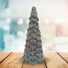 A handmade no-sew Christmas tree crafted from Tula Pink's Rainbow Hexie fabirc
