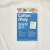 A close-up image of Matilda's Own 80/20 Cotton Poly Quilt Wadding with its blue product label displayed on top. The label highlights its composition of 80% cotton and 20% polyester, and includes icons noting features such as "Machine Washable," "Medium Loft," and "Made in Australia." The wadding width is marked as 2.4 metres. Additional details include a stitch distance of up to 10 inches, a shrinkage rate of 2.5%, and a note on its suitability for people with allergies. The bottom of the label features the Victorian Textiles logo and care instructions. The wadding beneath appears soft and off-white in colour.