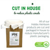 Image for Hobbs Heirloom quilting products featuring our eco-friendly initiative. The image shows a brown paper package with quilting wadding exposed at the top. Above the package, text states "CUT IN HOUSE to reduce plastic waste." Additional text emphasizes that all Hobbs Heirloom products are cut and packaged in-house to reduce the manufacturer's plastic packaging, underscored by a "PLASTIC FREE PACKAGING" logo with green leaves, indicating a commitment to environmental sustainability.