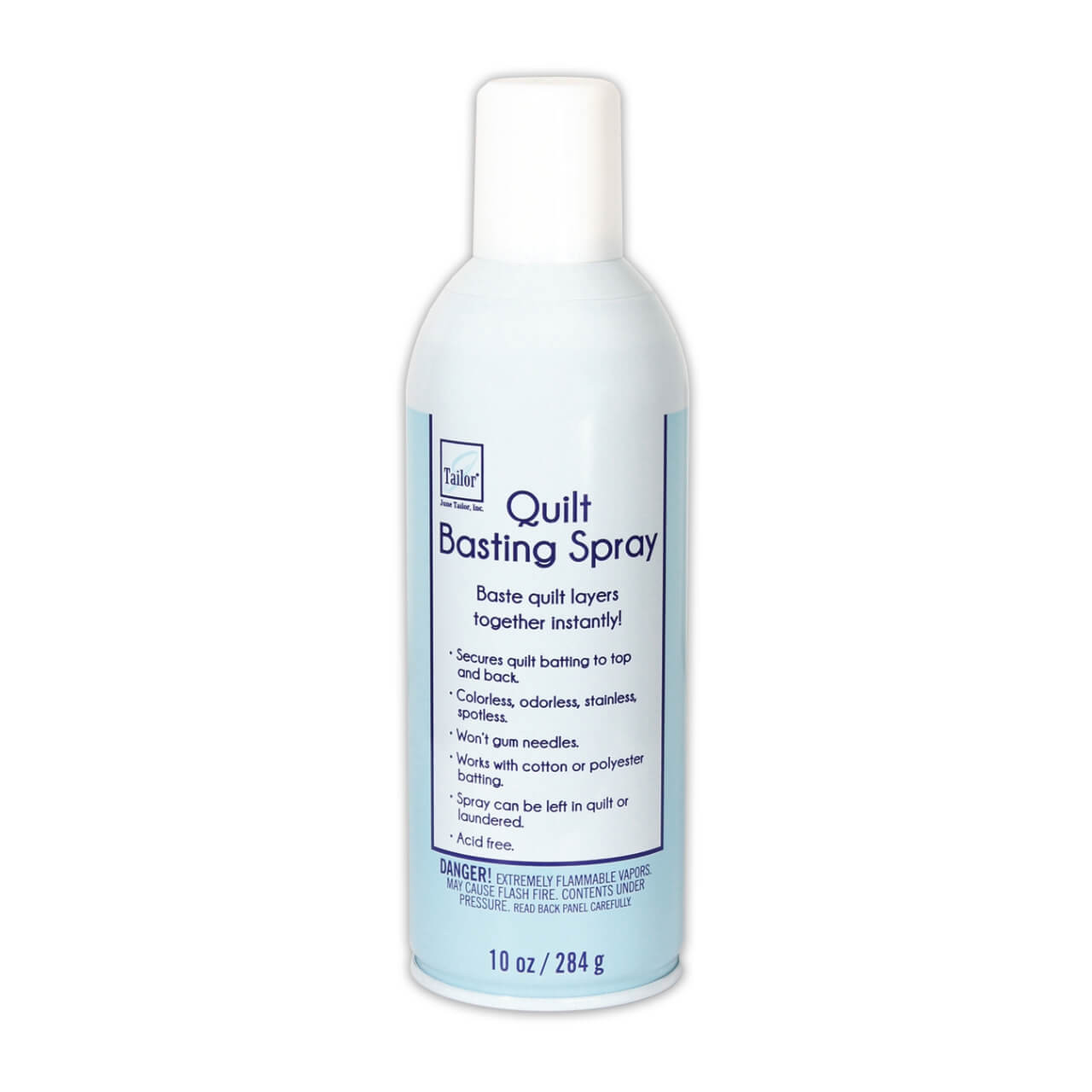 The image shows a 10-ounce bottle of June Tailor Quilt Basting Spray. The label indicates that it instantly secures quilt layers, is colorless, odorless, stainless, spotless, won't gum needles, works with cotton or polyester batting, and that the spray can be left in quilt or laundered. It also notes the product is acid-free and provides a warning about the flammability of the contents.