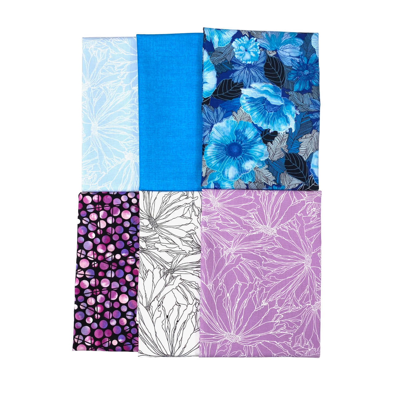 Six neatly arranged fabric squares from a quilting bundle, showcasing a variety of patterns including large blue florals on a dark background, light blue and white winter branches, a solid rich blue, detailed white flowers on a purple background, and abstract purple circles on black. The collection represents a diverse mix of prints and solids in shades of blue and purple, indicative of high-quality cotton quilting materials.