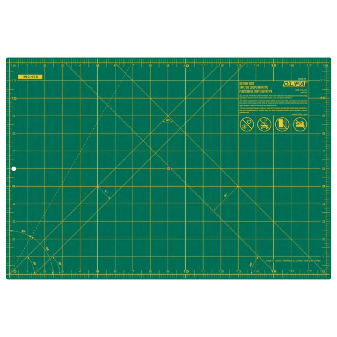 The image shows an OLFA RM-CG 12”x18” Double-Sided Rotary Mat in green with a detailed grid and measurement indicators in yellow. The mat includes various angled guidelines for precision cutting and features the OLFA logo and safety instructions in the top right corner.