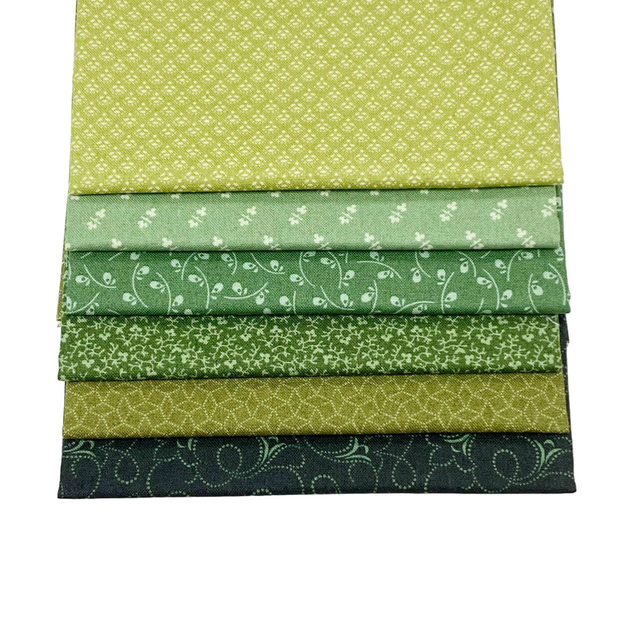 This image shows the 6 fat quarter fabrics from the Forest colourway in the Tonal Ditzy Collection.