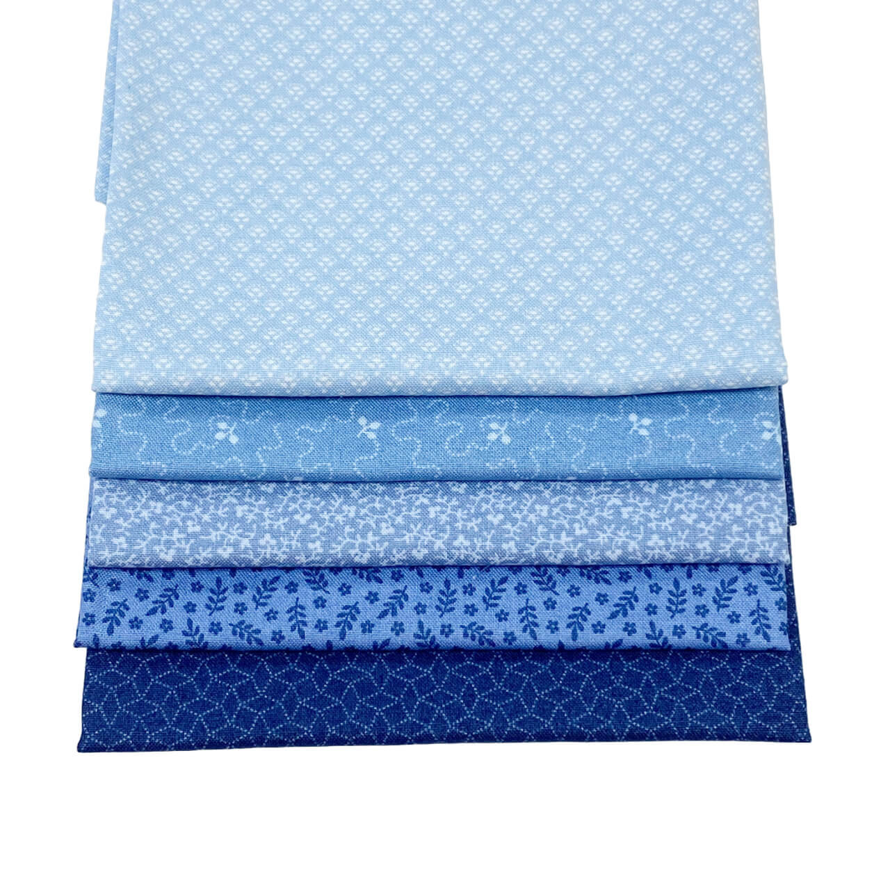 This image shows the 6 fat quarter fabrics from the Blue Indigo colourway in the Tonal Ditzy Collection.