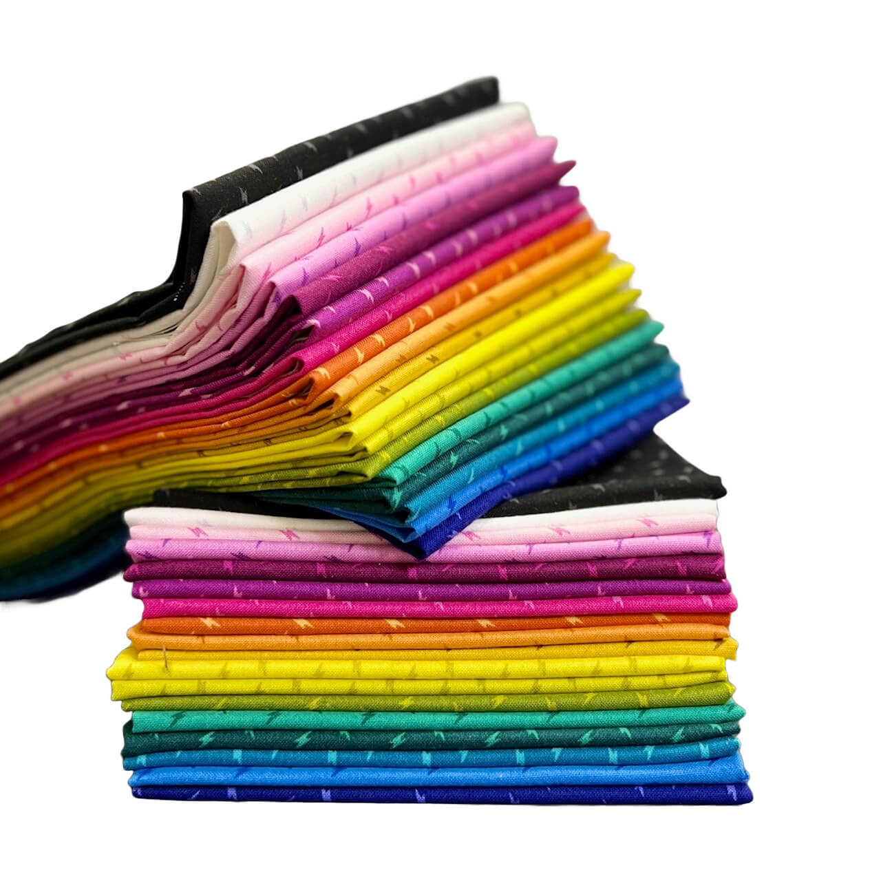 The image shows a collection of stacked fabric fat quarters from the Atomic collection.
