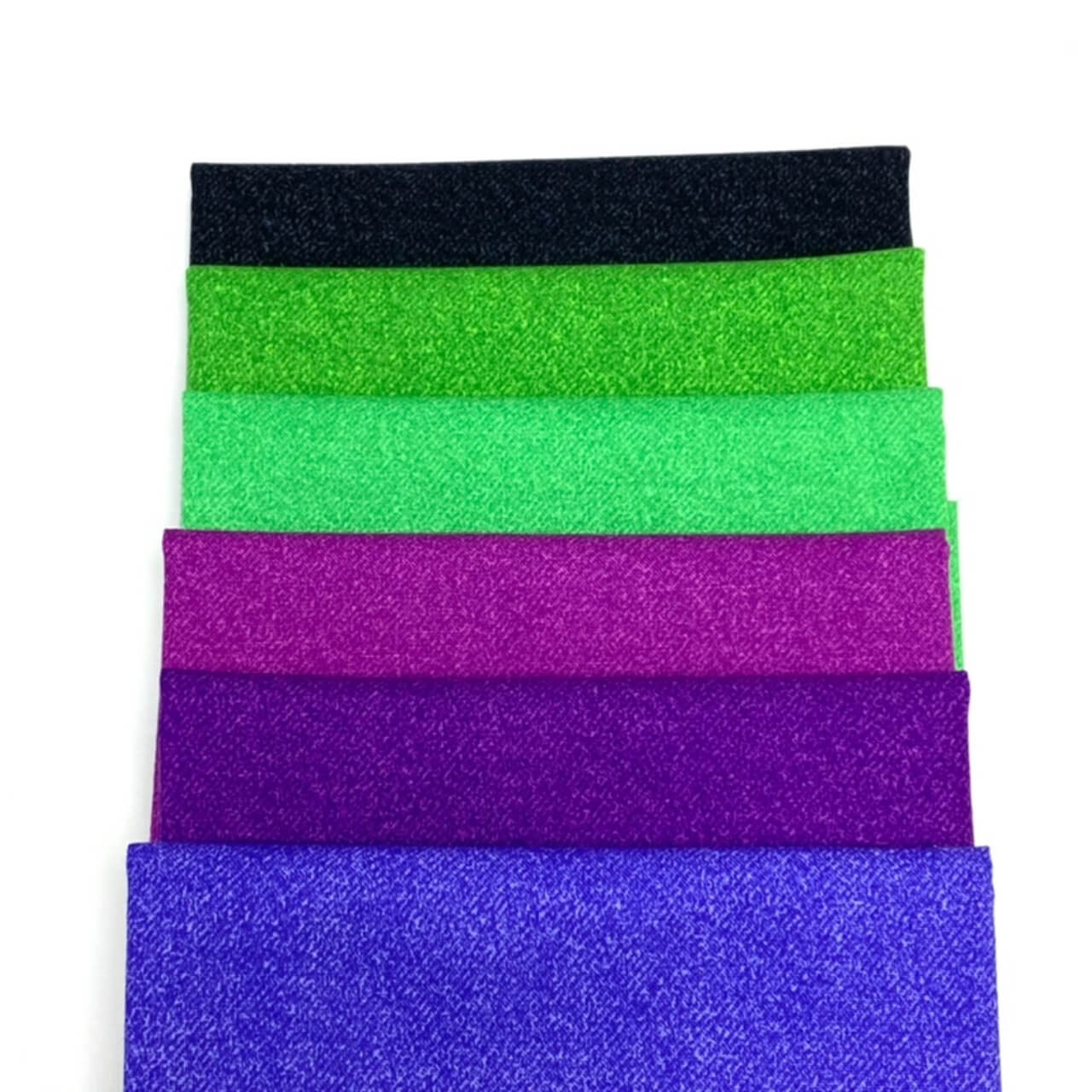 Studio-cut Phosphor Electric Jolt fat quarters in shades of green and purple.