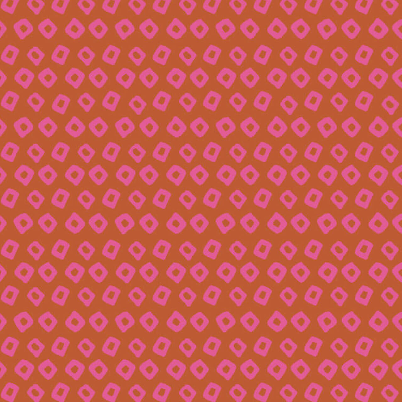 Close up Shibori in Wildrose quilting cotton fabric by Heather Ross for Windham Fabrics, featuring hand-drawn pink diamonds on a rich rose-orange background.