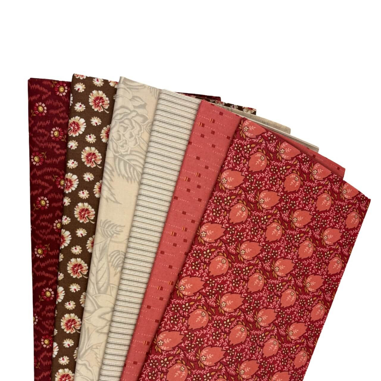 Rouge Mix Fat Quarter Bundle by Laundry Basket Quilts, featuring six red, brown, and cream floral and tonal prints fanned for display.
