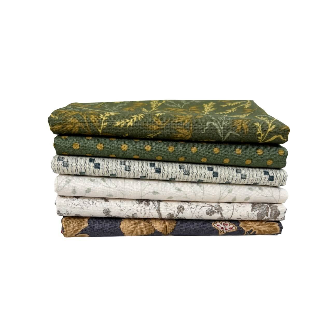 Green Garden Fat Quarter Bundle by Laundry Basket Quilts, featuring six green and cream floral and tonal prints stacked neatly.