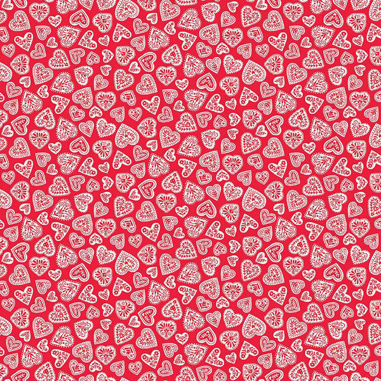 White Christmas cotton fabric with scattered red Scandinavian stars, snowflakes and starbursts from Makower’s Scandi Christmas collection