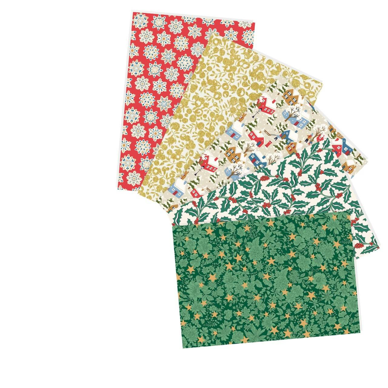 Yuletide Village fat quarter bundle featuring 5 Liberty cotton prints in red, green, cream, and gold with festive snowflakes, holly, and village motifs