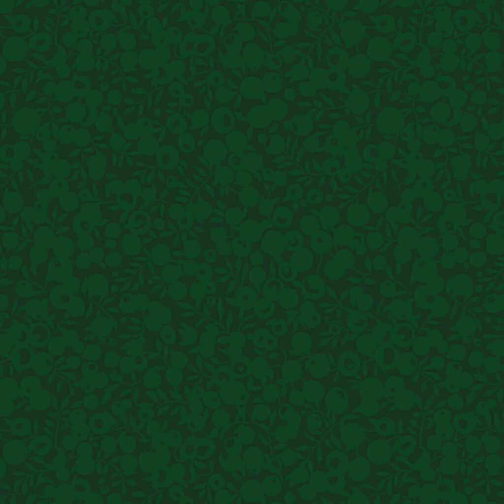 Wiltshire Forest fabric by Liberty featuring a tonal green berry and leaf print on premium cotton quilting fabric