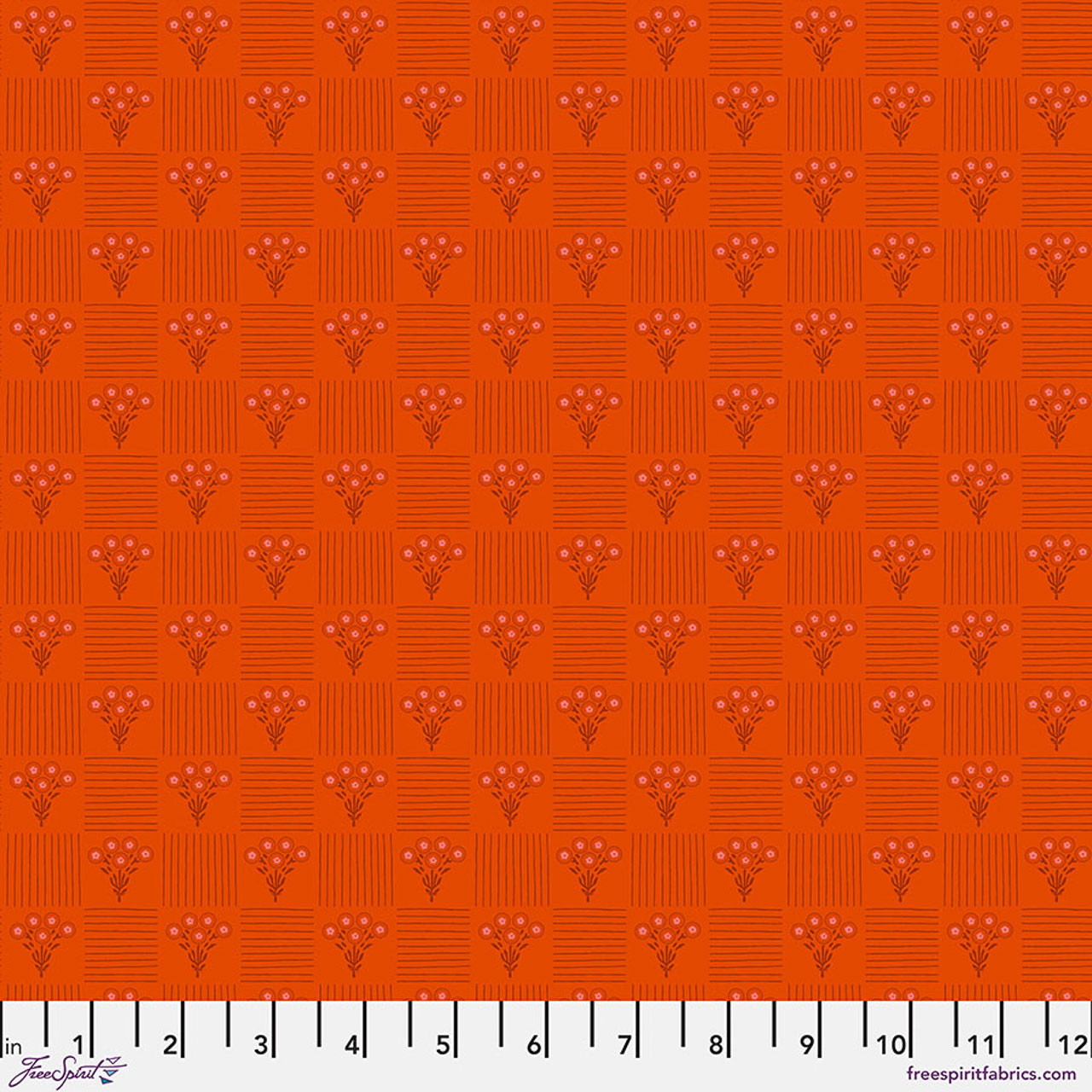 Free Spirit Pop Cloth Life - Love fabric featuring orange patchwork-style blocks with floral bouquets and striped geometric details