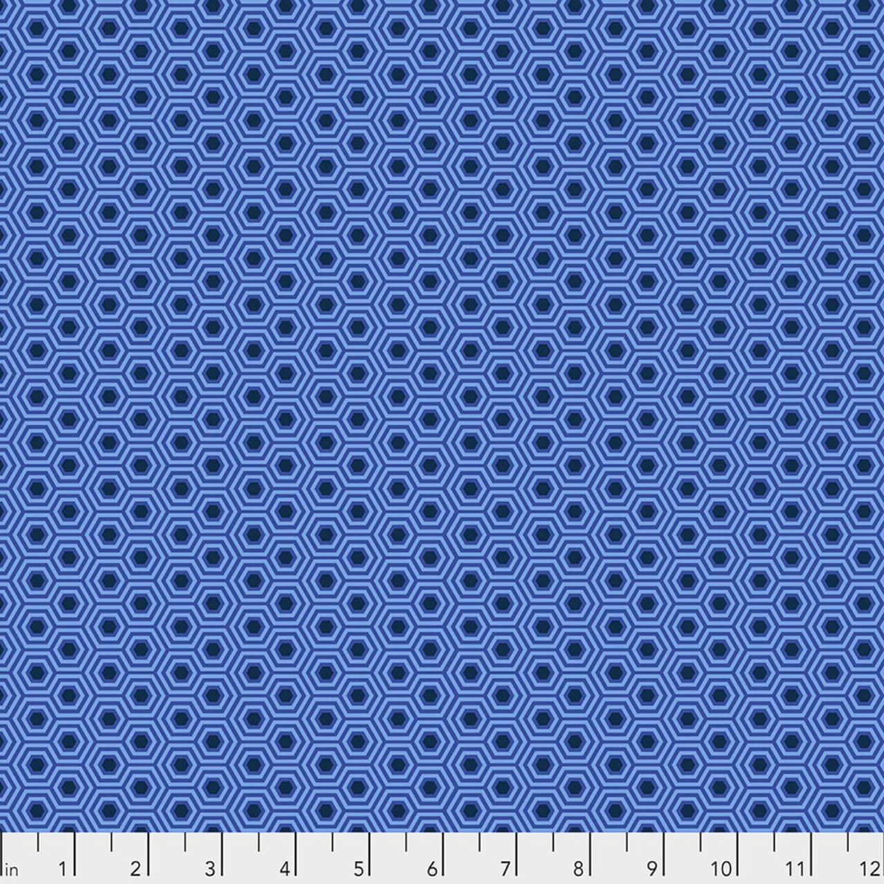 Hexy in Deep Sea by Tula Pink for FreeSpirit Fabrics featuring layered navy and blue hexagons on a periwinkle-blue background from the True Colors collection.