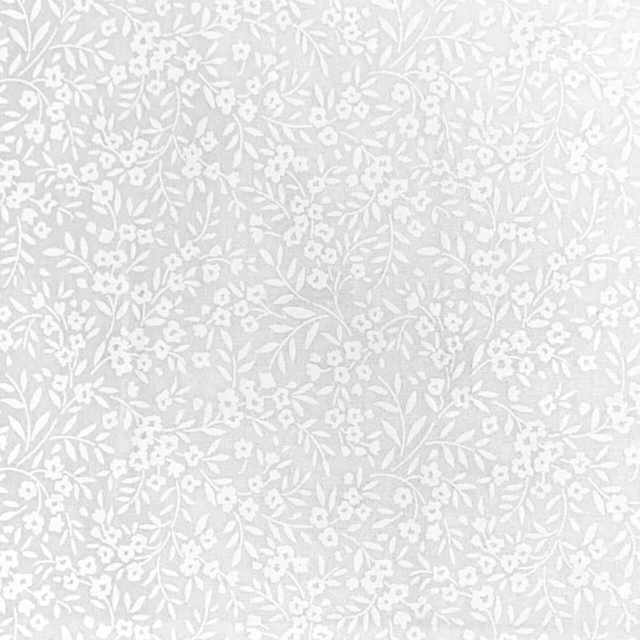 Close-up of Fabric Freedom Vine & Flowers white on white cotton fabric featuring delicate trailing vines and tiny blossoms.