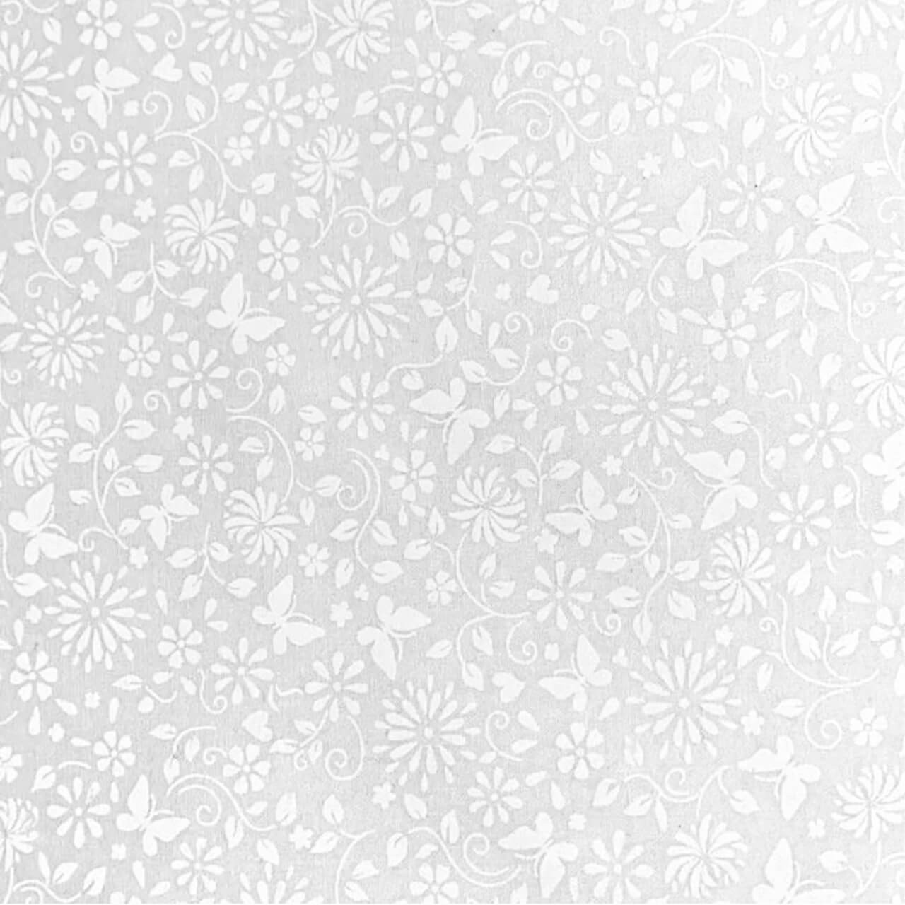 Close-up of Fabric Freedom Butterflies & Flowers white-on-white cotton fabric featuring delicate butterflies, flowers and swirling vines.