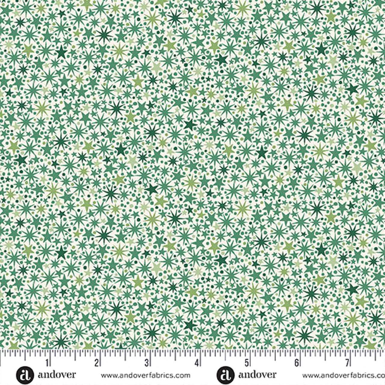 Makower UK The Nutcracker Collection Twinkle Green on Cream fabric with green stars and starbursts on cream, shown with a ruler for scale.