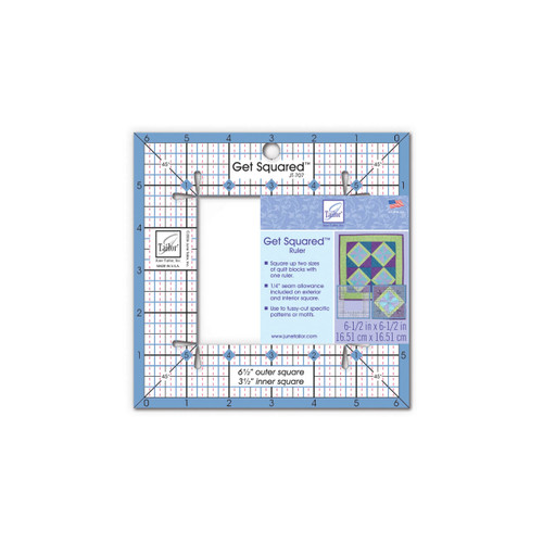The Small Get Squared Ruler by June Tailor, a clear, square ruler with a central cut-out, marked with precise measurements for quilting, and instructions for use on the label.