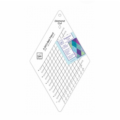 The June Tailor Diamond Cut Ruler, a transparent, diamond-shaped quilting ruler with diagonal lines for precise cutting, displayed with instructions and a sample quilt pattern on the label.