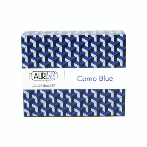 Packaging for Aurifil's Como Blue Color Builder, featuring a 3D cubic pattern in various shades of blue, with the Aurifil logo and "Como Blue" text on the label.